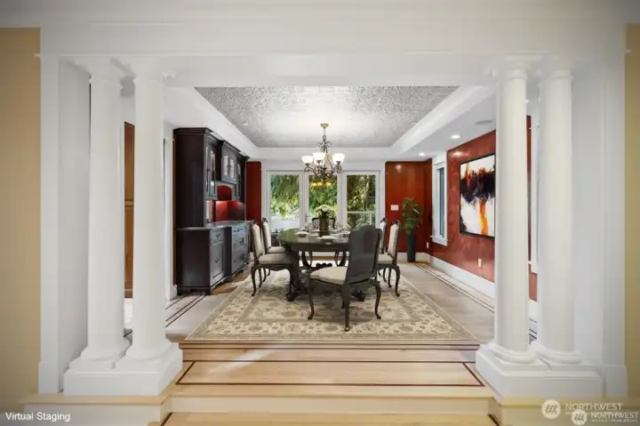 Formal Entertaining Dining Room with Specialty Crafted built-in display cabinets and convenient pass through serving window. Beautiful Venetian Plaster walls accented with Traditional 1875 Style Stamped Tin Ceiling.