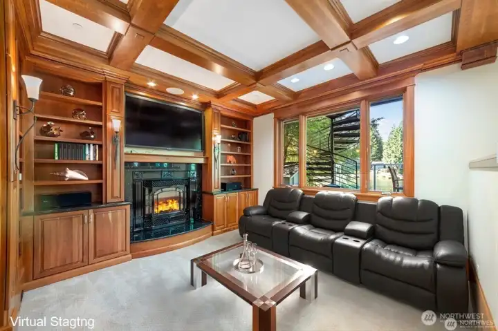 Family room accented by dramatic crown molding, faux beams & chocolate glazed millwork. All with lake views.