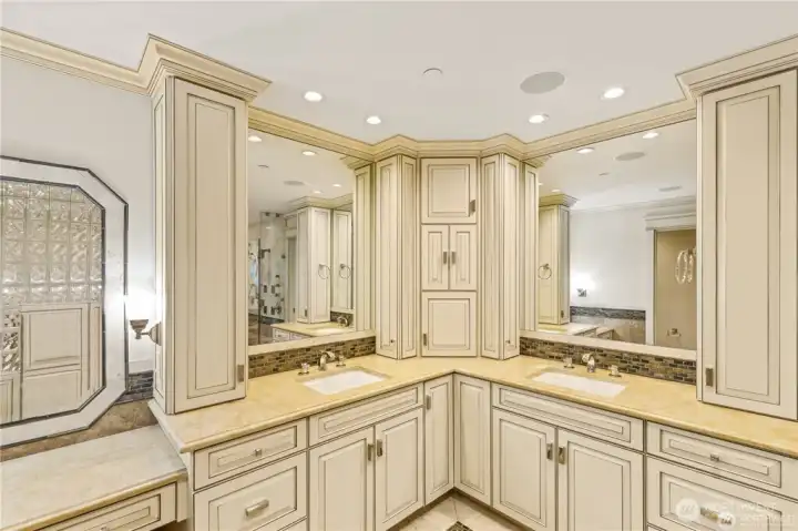 His and Hers Luxury bathroom with her own makeup vanity with mirror. Beautiful marble counters & heated flooring. Canyon Creek cabinets accented by Crown Molding.