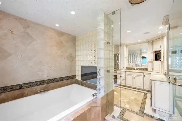 Oversized bathtub to relax and watch your favorite cable channels with your waterproof tv from England.