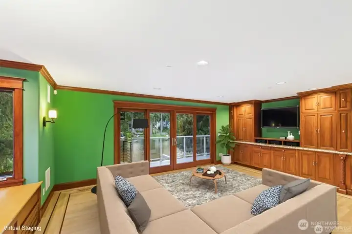 Childrens Wing Bonus/Recreation Room. Wall of Canyon Creek cabinets with wetbar, refreigerator, ample storage. White Tiger granite counters. Flat Screen TV stays.