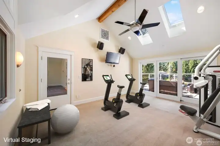 Lets GO, get fit in this home gym with designer ceiling fan, skylights that open & high quality commercial grade carpet/pad.