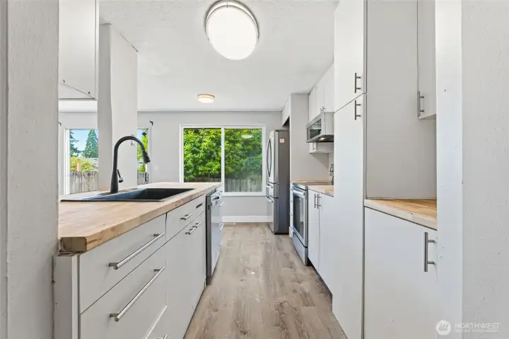 Recently remodeled modern kitchen featuring brand new butcher block counters!