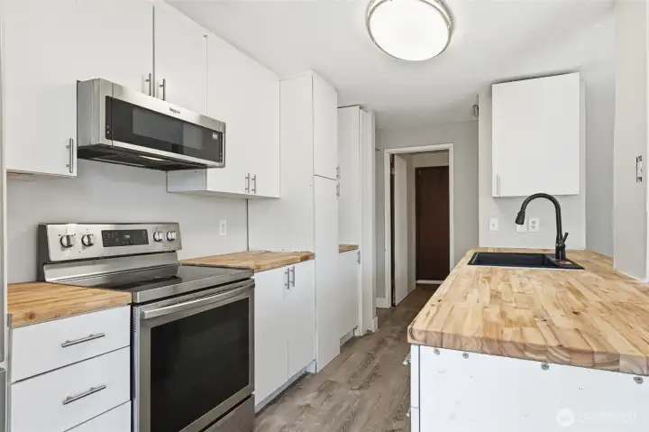 Stainless steel appliances with built in microwave.