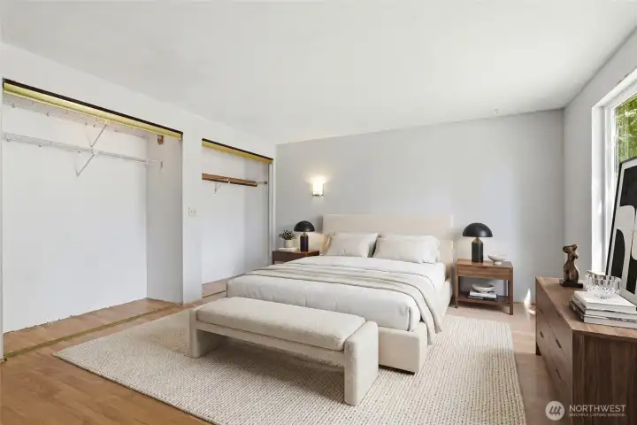 Virtually staged main level owners suite.