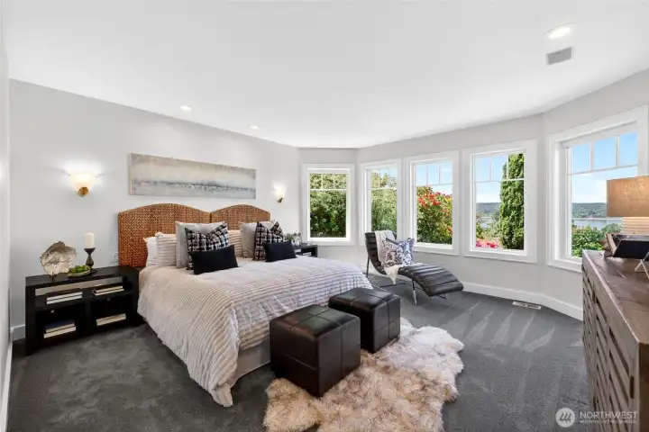 Primary bedroom with water views located on the main floor.