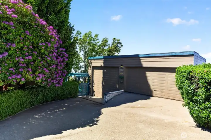 Three car detached garage. One slot has RV height.