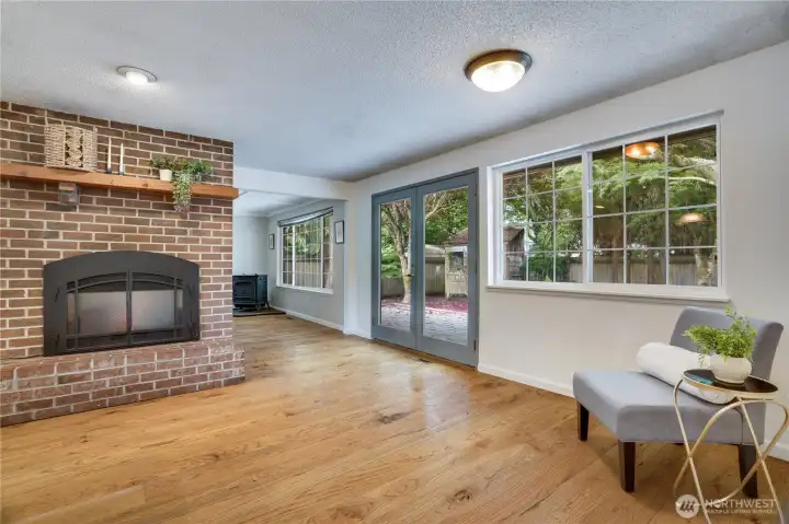 The living room connects seamlessly to the kitchen, while French doors provide easy access to the backyard patio. The living room connects seamlessly to the kitchen, while French doors provide easy access to the backyard patio.