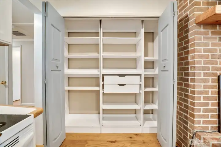 Built-in organizers and generous shelving make it easy to keep groceries, small appliances, and pantry staples neatly stored. Built-in organizers and generous shelving make it easy to keep groceries, small appliances, and pantry staples neatly stored.
