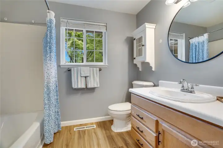 Located just steps from the primary bedroom, the full bath features luxury vinyl plank flooring, natural light, and everyday functionality. Located just steps from the primary bedroom, the full bath features luxury vinyl plank flooring, natural light, and everyday functionality.