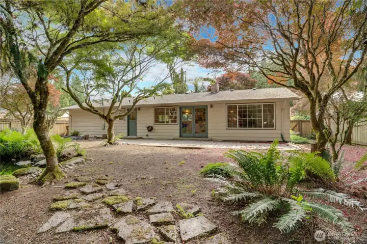 Surrounded by greenery and thoughtfully shaped outdoor spaces, the backyard offers a wonderful extension of the home’s living areas. Surrounded by greenery and thoughtfully shaped outdoor spaces, the backyard offers a wonderful extension of the home’s living areas.