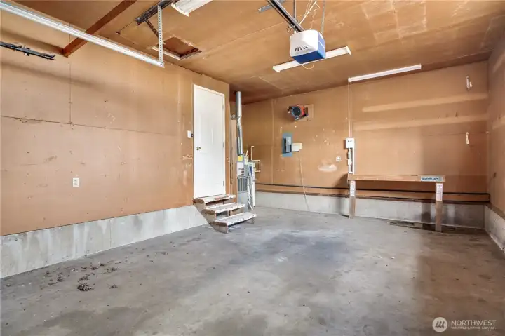 The attached one-car garage includes an automatic opener and additional space for storage, hobbies, or a workshop. The attached one-car garage includes an automatic opener and additional space for storage, hobbies, or a workshop.