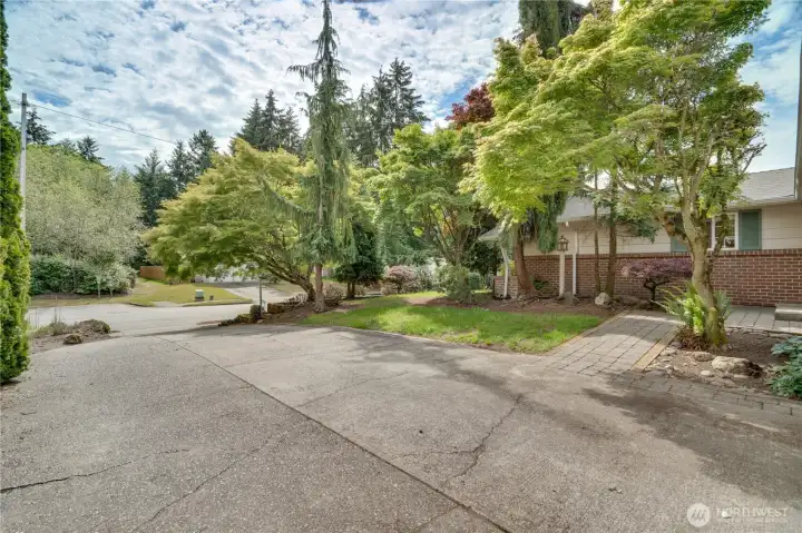 A long driveway provides parking for multiple vehicles and offers space for a boat, RV, or recreational equipment. A long driveway provides parking for multiple vehicles and offers space for a boat, RV, or recreational equipment.