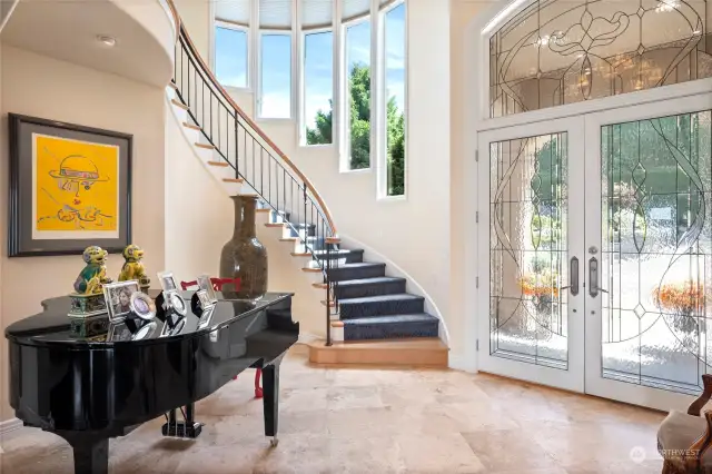 Soaring ceilings and elegant winding staircase