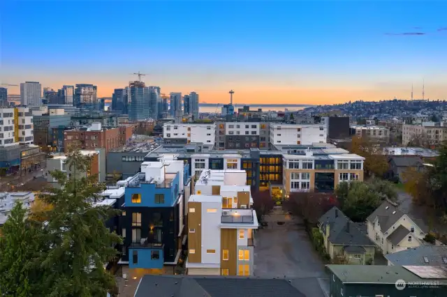 This aerial view showcases your proximity to the vibrant Seattle skyline, the Space Needle, and the beauty of Puget Sound—a prime location for the ultimate urban lifestyle.