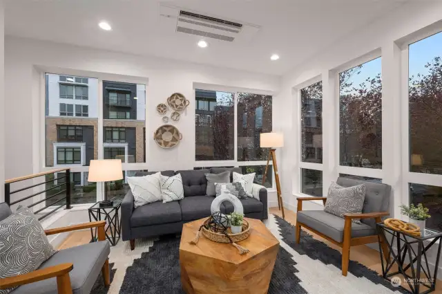 Bright, airy, and drenched in natural light—this living space is a true sanctuary for relaxation or entertaining.