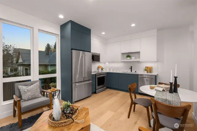 The heart of the home, this sleek kitchen features stainless steel appliances, designer cabinetry, and gorgeous views.