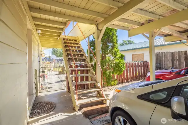 Covered staircase to the upper level units which are accessed from the front carports.