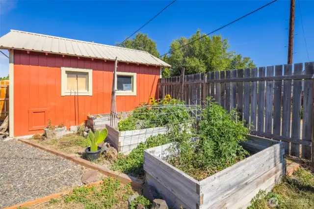 Studio, garden space, and privacy fencing are great amenities for this rental home or owner's residence with tri-plex at the front.