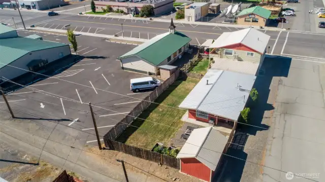 The 2bed/1bath home has a large fenced yard with garden space, covered patio, and entertaining areas, as well as a detached studio/bunkhouse.
