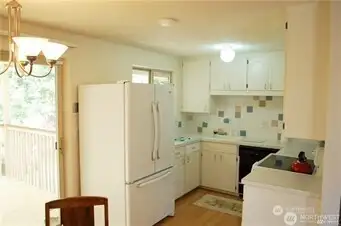 The kitchen has a compact,efficient design.