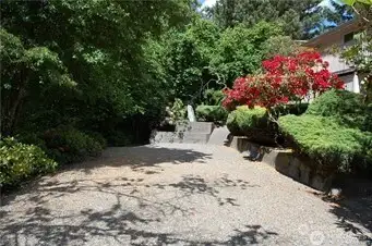 The side yard allows for extra parking for you ad your guests.