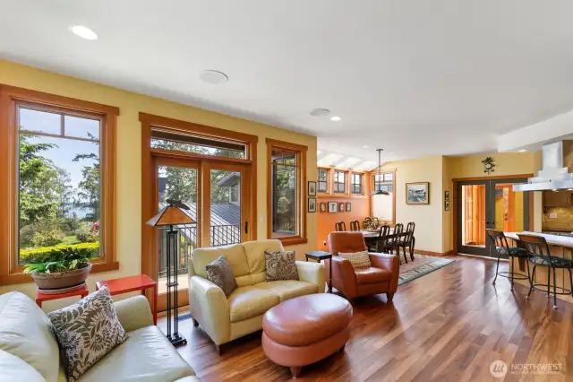Looking from the bookshelf to the view, dining area and the propane stove counter in the kitchen