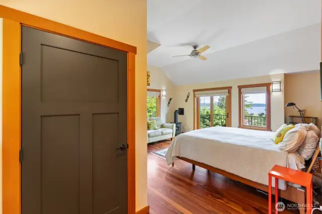 Down the hall is the primary bedroom with a balcony to the view. A propane stove for cozy nights. This door is a closet now however it is also the prepared elevator space, you will notice a door like this on every floor. The wiring is installed. The closet floor was installed for easy removal