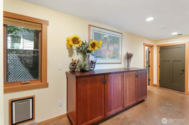 Built in dog door and hallway to guest bedrooms.