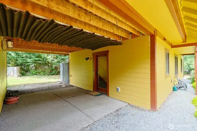 Covered breezeway from the 2 car garage to the back door of the home.