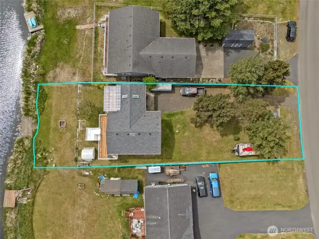 Large lot with mature trees and partially fenced.