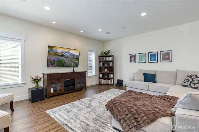 Living/great room with surround sound speaker system