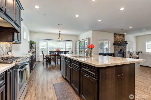 Gas range, quartz counters, huge island with counter seating