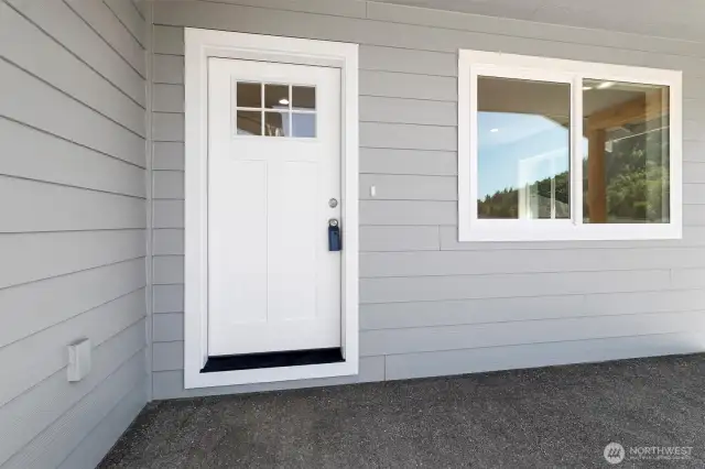 Front door with wonderful exposed aggregate front patio!