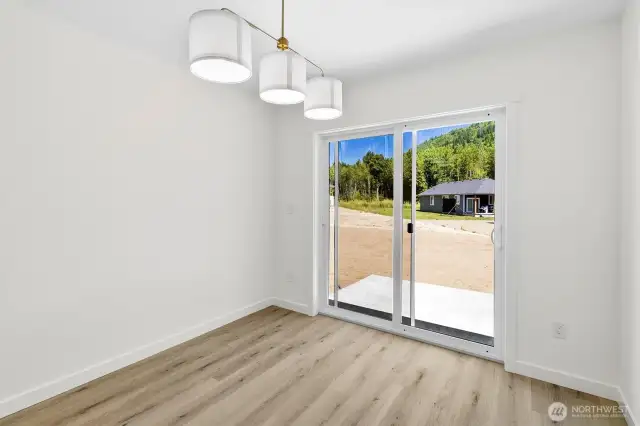 Dining area with sliding glass door out to the back patio.
