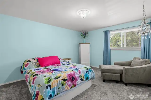 The bedroom is designed with comfort in mind, featuring built-in California Closets for seamless organization.