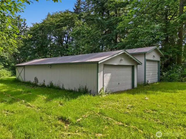 2 of the 3 large outbuildings on the property.  Bring the toys and tools to this rare find!