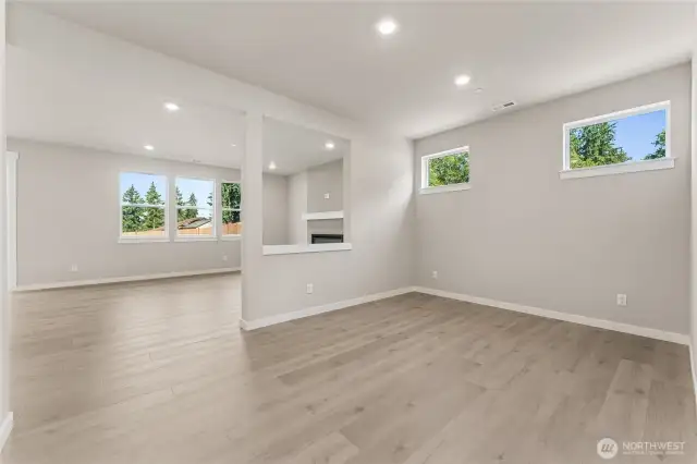Extended hardwood laminate flooring throughout the first floor.  Photos are for representational purposes only. Colors and finishes may vary