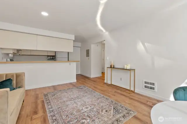 Tastefully updated with hard-surface floors throughout, freshly painted in a soothing neutral cream, and accented with stylish brushed-gold fixtures for an elegant, modern touch