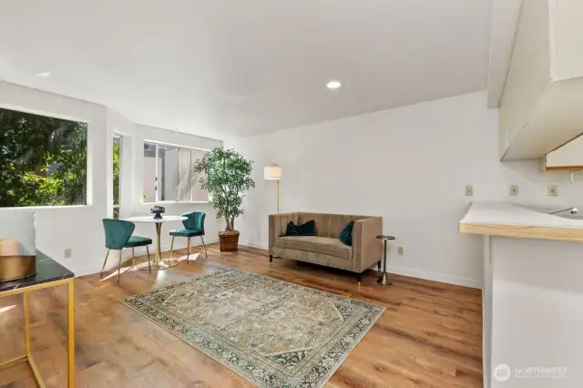 Tastefully updated with hard-surface floors throughout, freshly painted in a soothing neutral cream, and accented with stylish brushed-gold fixtures for an elegant, modern touch