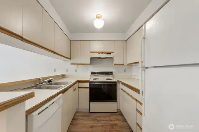 The kitchen, meanwhile, is a blank canvas awaiting your creative vision—perfectly functional, yet ready for someone to whisk it into the modern era with a dash of style and an upgrade or two.