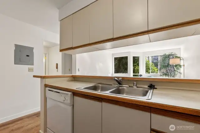 The kitchen, meanwhile, is a blank canvas awaiting your creative vision—perfectly functional, yet ready for someone to whisk it into the modern era with a dash of style and an upgrade or two.
