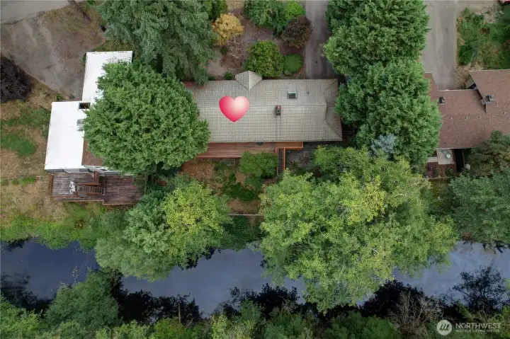 An aerial view of the house and lake