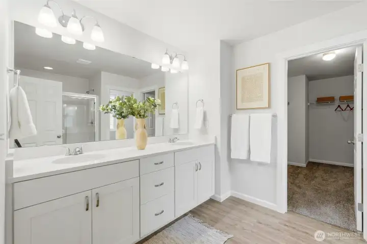 En-suite bathroom features double sinks, shower and large walk-in closet