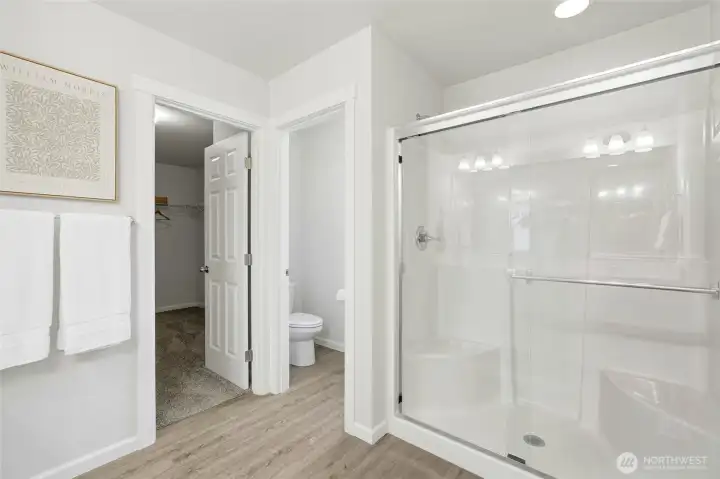 En-suite bathroom features double sinks, shower and large walk-in closet