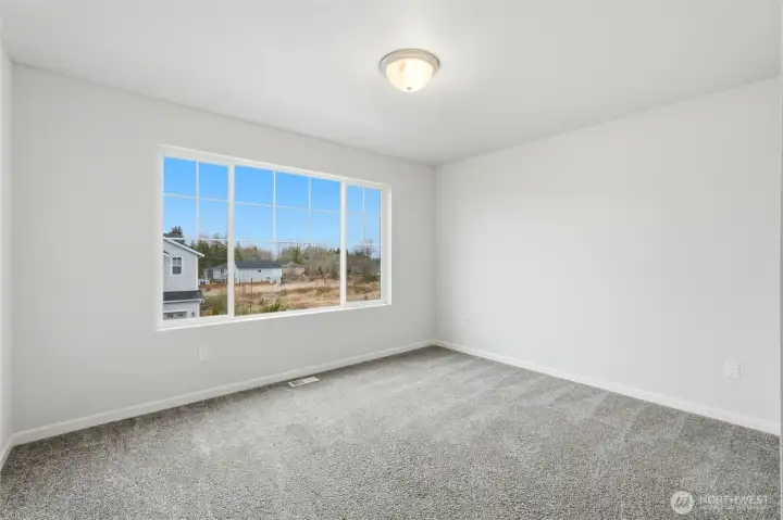 3rd bedroom on upper level overlooking front street