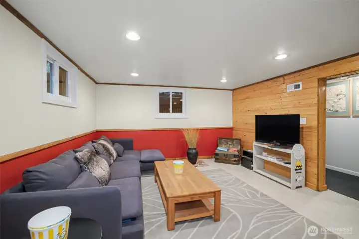 The lower level offers a rec room space, bedroom and convenient half bath.