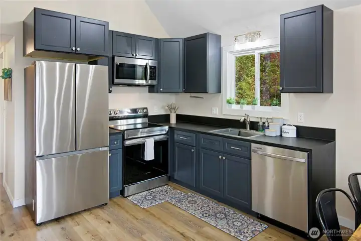 Efficient kitchen with quality appliances and finishes including Richlite countertops