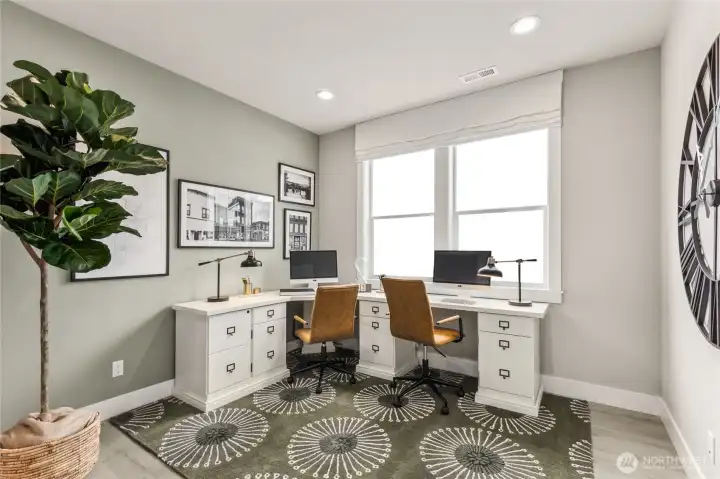 Main level bedroom/office with a large walk-in closet. Photo is representational. Actual home is under construction and materials, colors, and finishes will vary. See site agent for details.