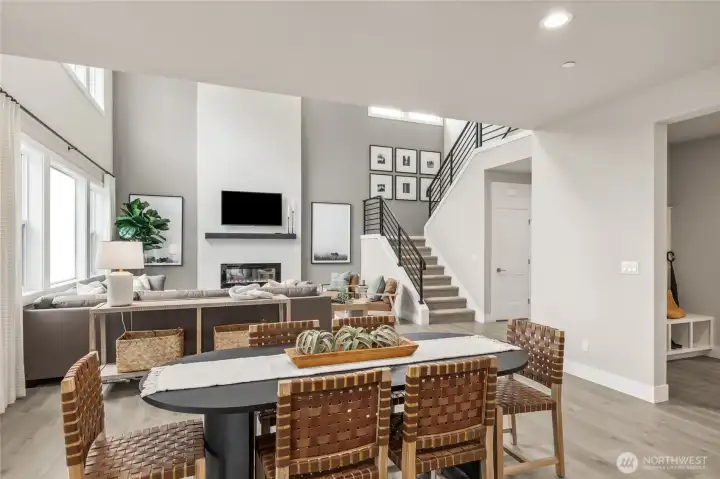 Separate eating area by the kitchen leads you into spacious great room with vaulted ceilings. Photo is representational. Actual home is under construction and materials, colors, and finishes will vary. See site agent for details.